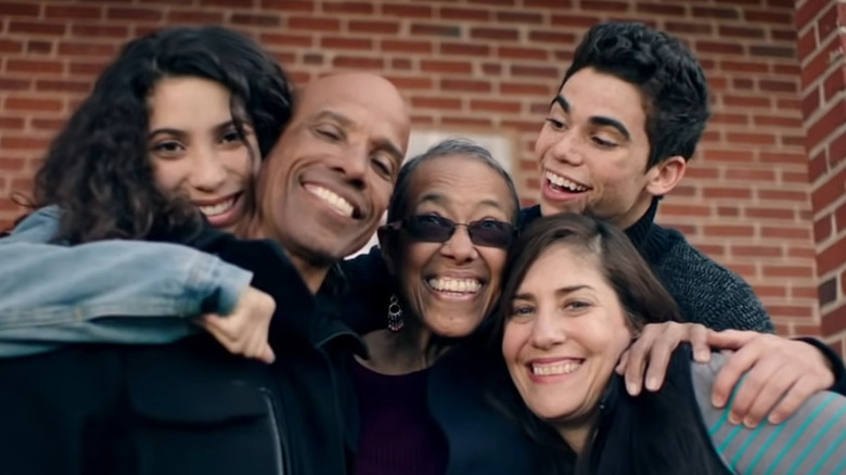 The Boyce family smiling together