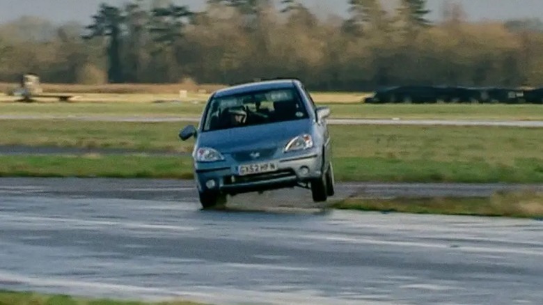 Michael Gambon racing a car