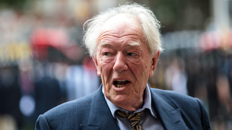 Michael Gambon walking in street