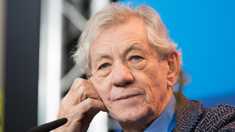 Ian McKellen holding his head