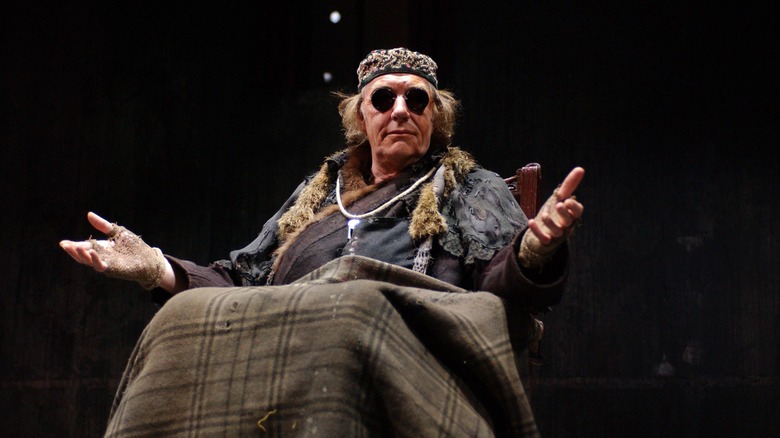 Michael Gambon in glasses on stage