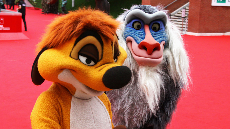 Timon and Rafiki walk-around characters meeting