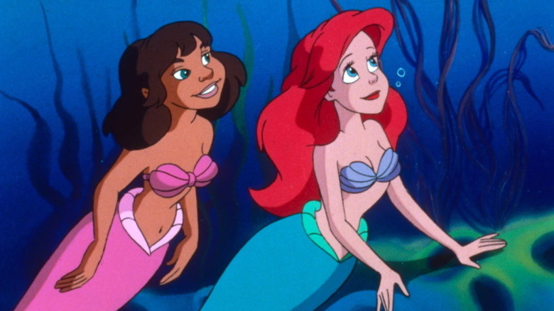 Ariel and friend look up to side