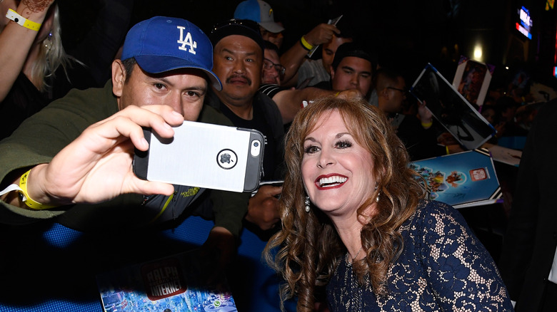 Jodi Benson takes photo with fan