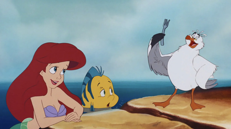 Ariel, Flounder, and Scuttle look at fork