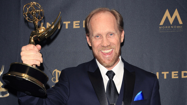 Jeff Bennett holding his Emmy