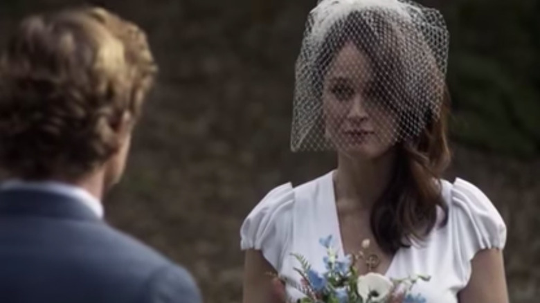 Lisbon standing on front of Jane in wedding dress The Mentalist