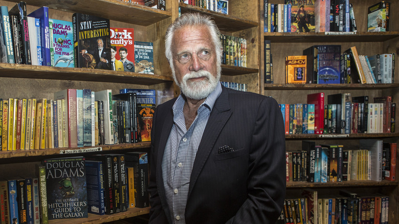 Jonathan Goldsmith poses with books