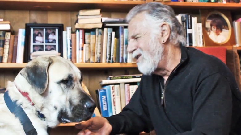 Jonathan Goldsmith with a dog