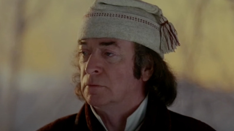 Michael Caine as Scrooge, looking off