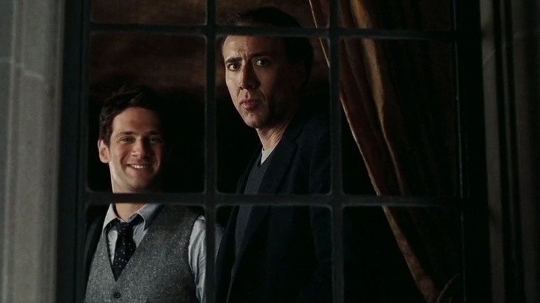 Nicolas Cage looks ominous in a window National Treasure