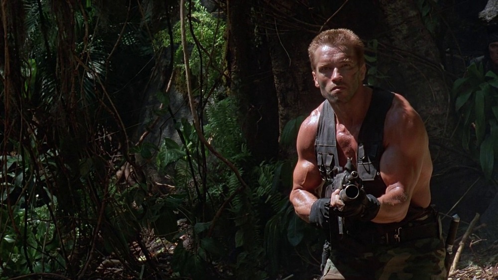 Arnold Schwarzenegger holding gun