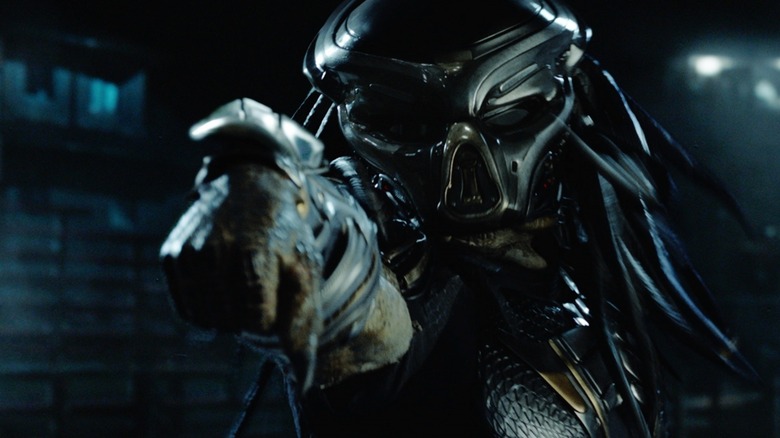 The Predator pointing its arm cannon