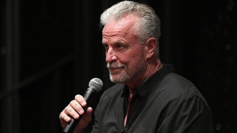 Nick Cassavetes holding a microphone