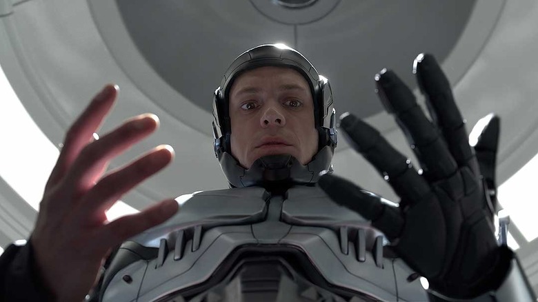 RoboCop looking at his hands