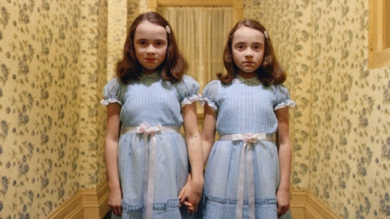 Shining creepy twins hold hands