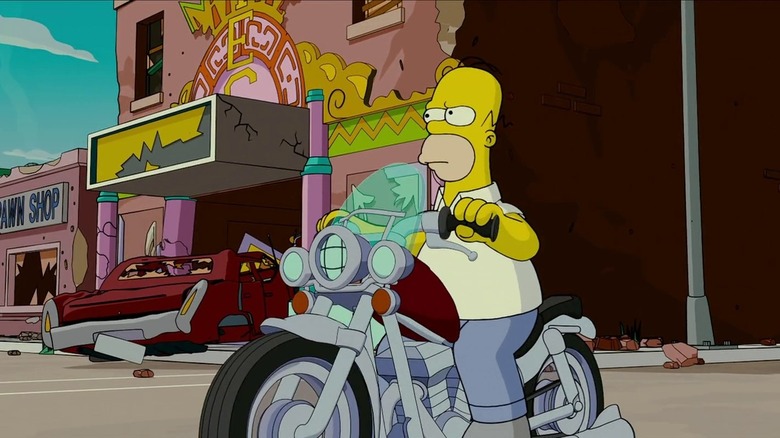 Homer Simpson sitting determined on a motorcycle