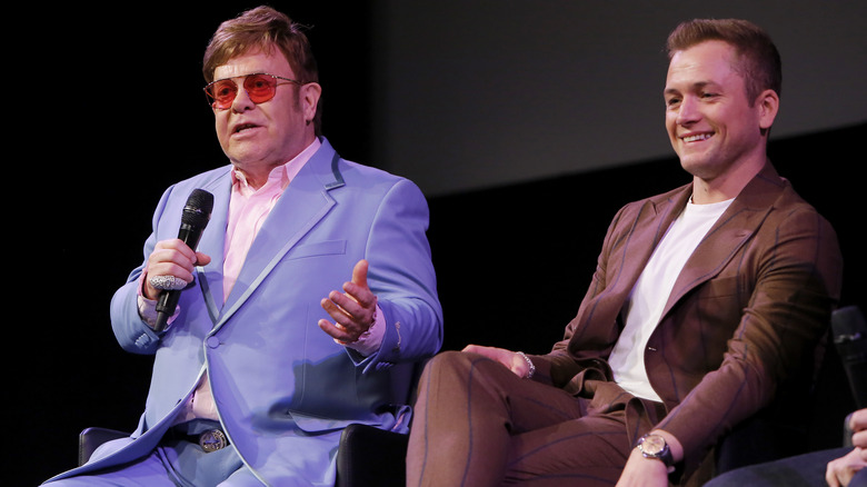 Elton John and Taron Egerton on stage