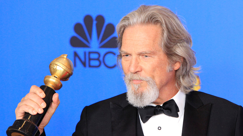 Jeff Bridges holding an award