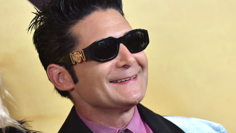 Corey Feldman smiling in sunglasses