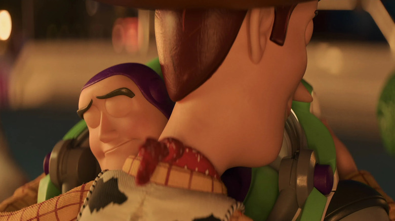 Buzz hugging Woody