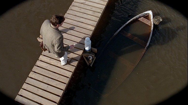 Truman stares at canoe