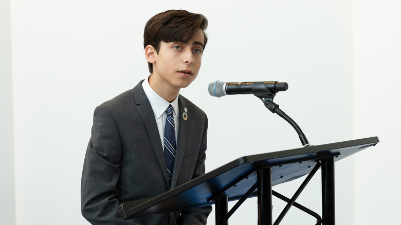 Aidan Gallagher giving speech