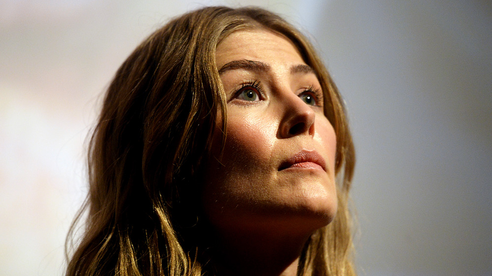 Rosamund Pike looking up