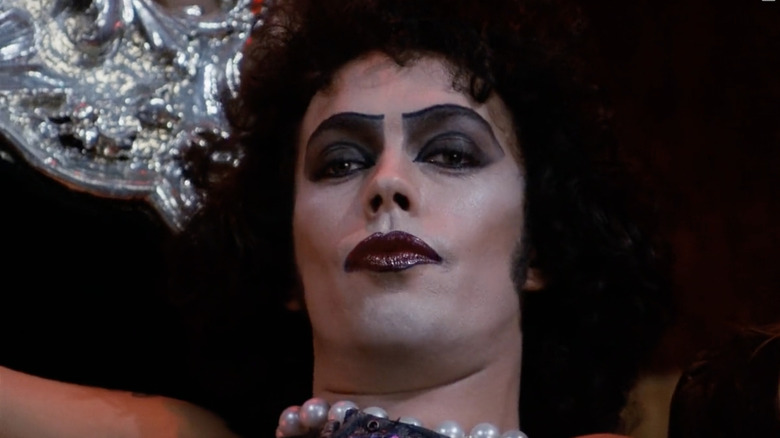 Frank-N-Furter smiling salaciously