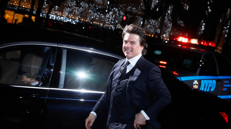 Tom Cruise getting out of a car 