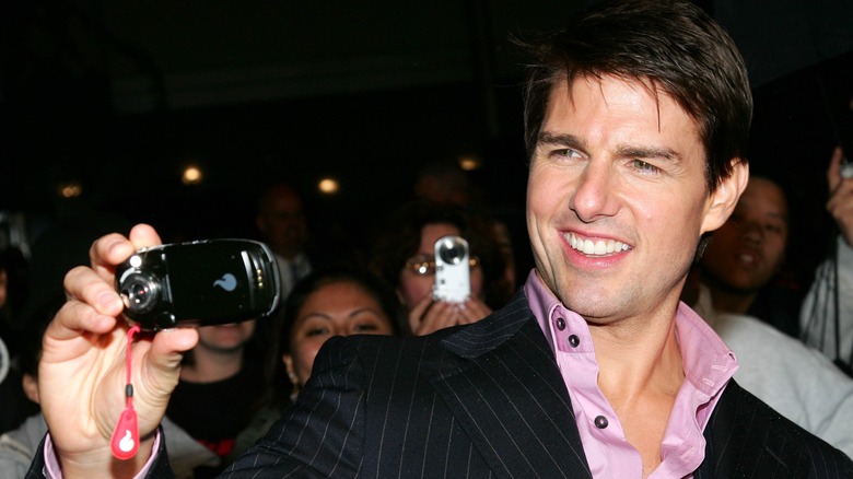 Tom Cruise taking a picture