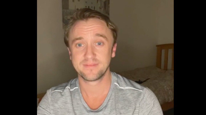 Tom Felton staring in disbelief