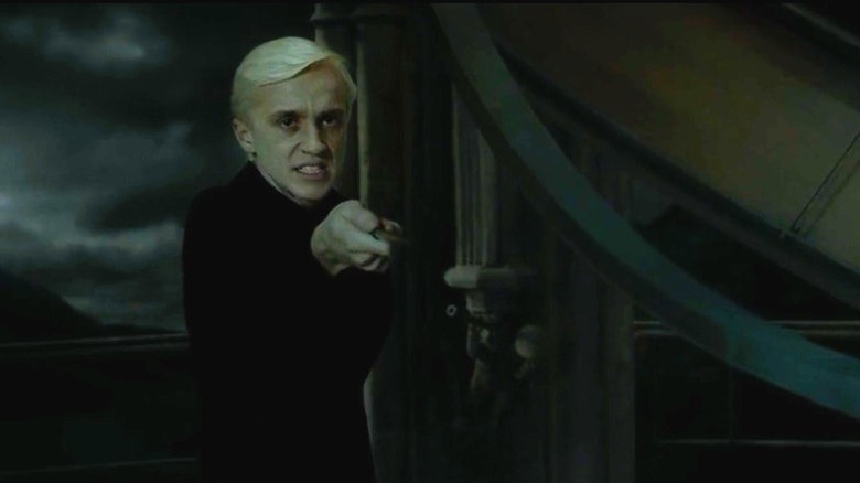 Draco threatening with his wand