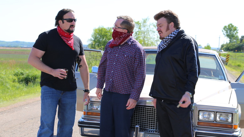 Trailer Park Boys stand in front of car