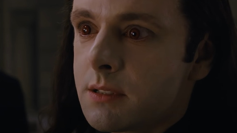 Aro widens his blood-red eyes