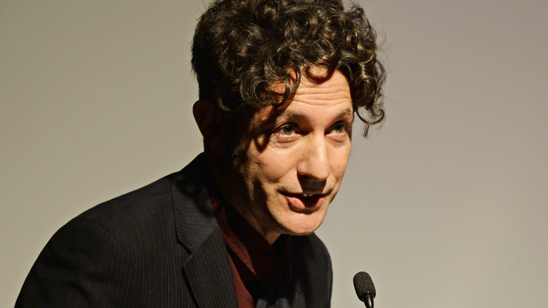 Jonathan Glazer speaking into microphone