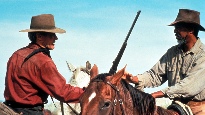 Eastwood and Freeman on horses 