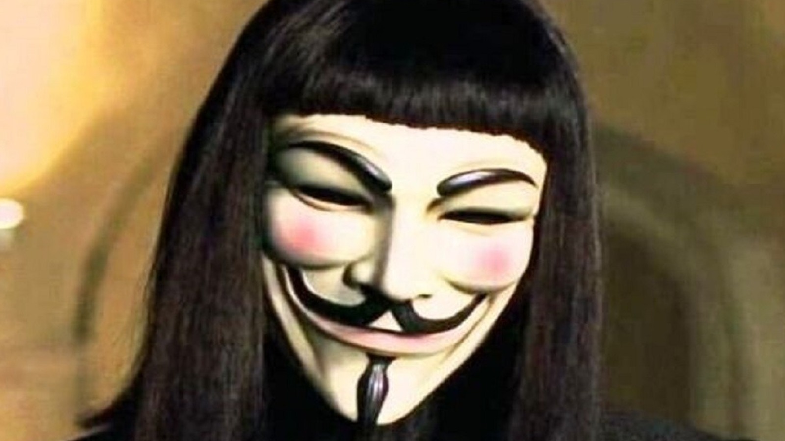 Hugo Weaving, with the Guy Fawkes mask he wore in V for Vendetta.