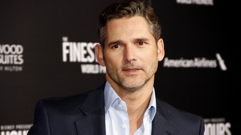 Eric Bana wearing a suit