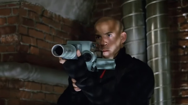 Xander Cage holding a weapon