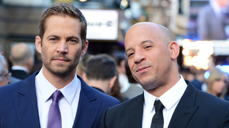 Paul Walker and Vin Diesel standing together