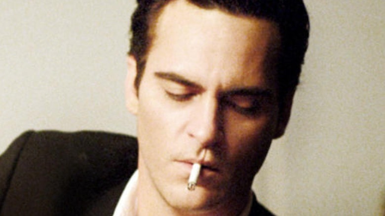 Joaquin Phoenix smokes