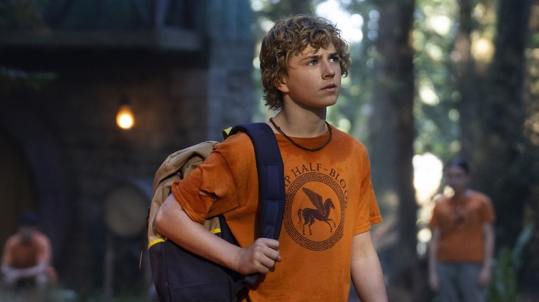 Percy Jackson holding a backpack