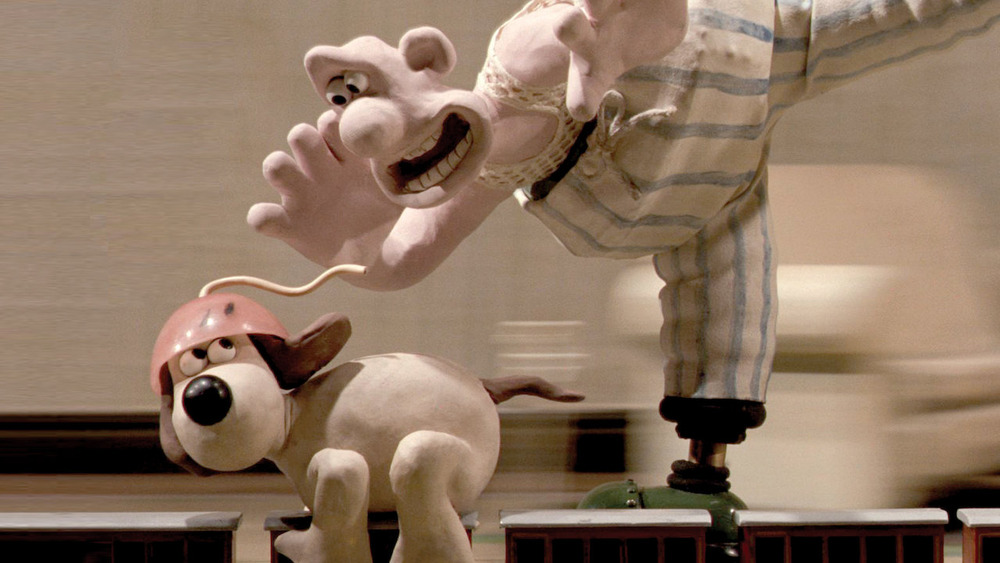 Wallace and Gromit riding toy trains