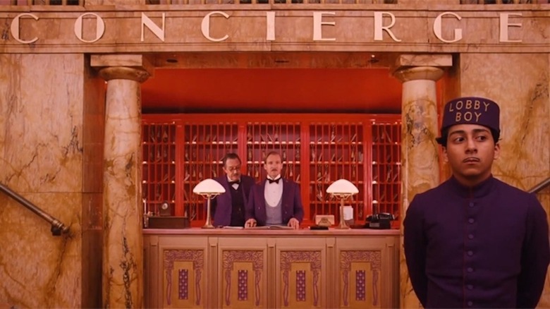 Zero standing while Gustave H. works the concierge desk