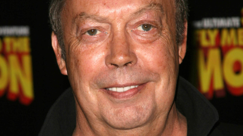 Tim Curry smiling at premiere