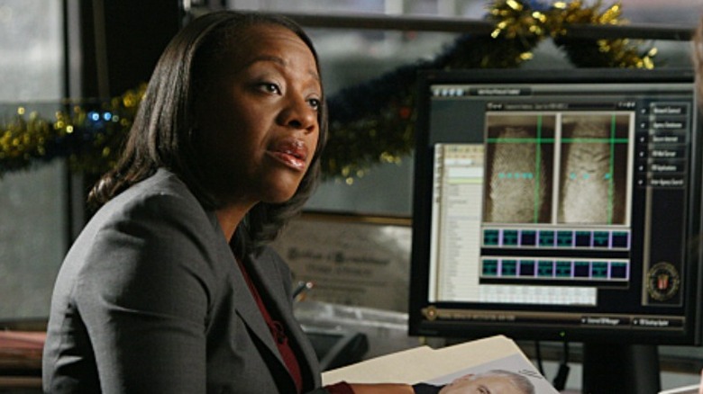 Marianne Jean-Baptiste sitting at a desk with a computer