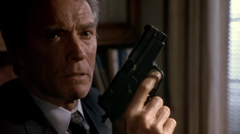 Clint Eastwood holding a pistol