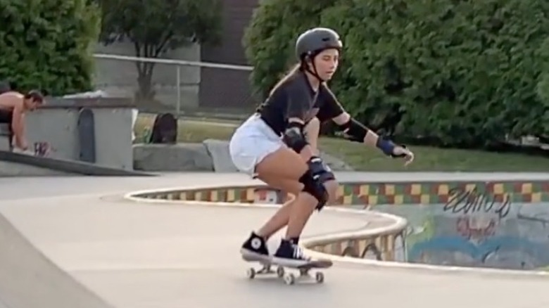 Gomez skateboarding