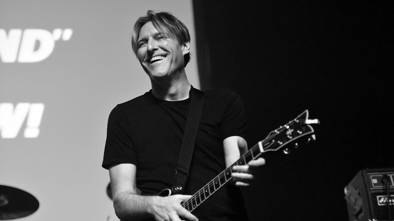 Tyler Bates playing guitar